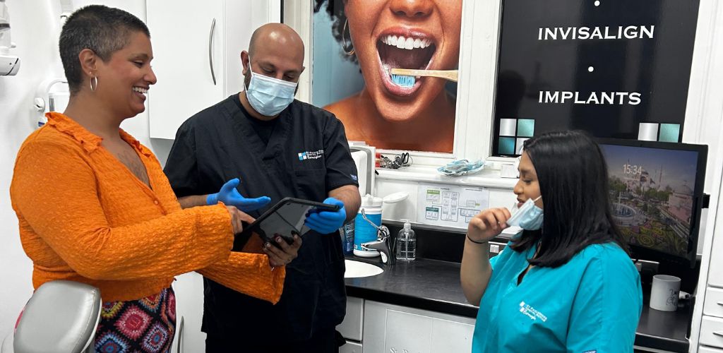 What Happens During a Smile Consultation in Birmingham? 2 Dentist explaining smile consultation treatment plan to patient in Birmingham dental clinic